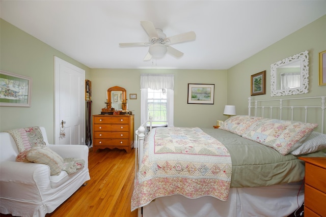 bedroom featuring a ceiling fan and light wood finished floors