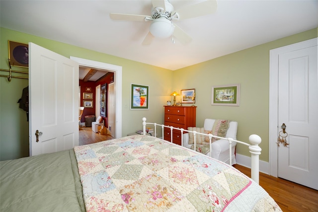bedroom featuring a ceiling fan and wood finished floors