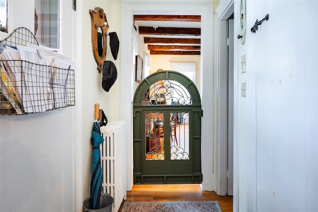 property entrance featuring radiator heating unit