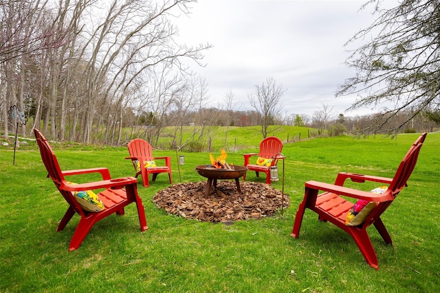 view of yard with an outdoor fire pit