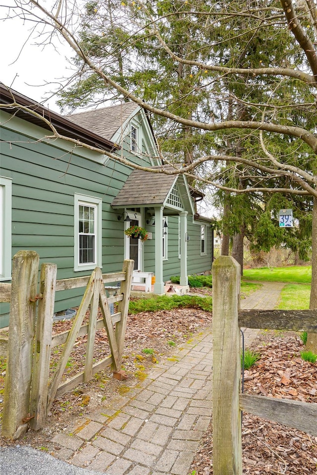 view of front facade with a shingled roof