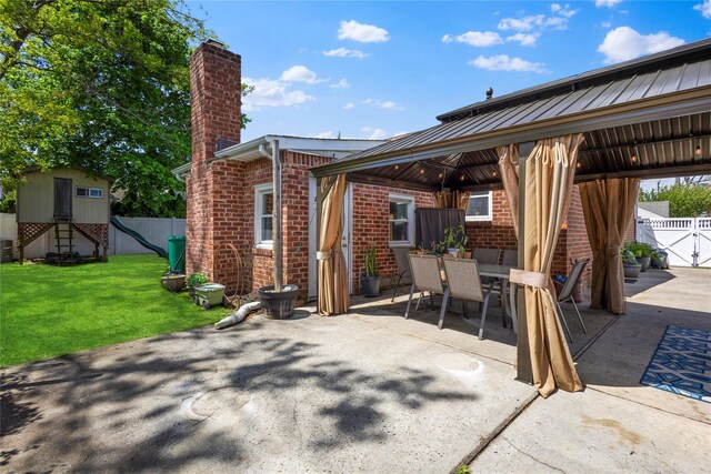 1037 Chestnut St, North Valley Stream, NY 11580 - view of patio with a gazebo, outdoor dining area, and an outbuilding