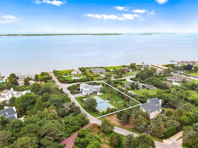 drone / aerial view featuring a water view and a residential view