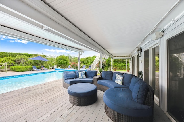 wooden terrace featuring an outdoor living space and an outdoor pool