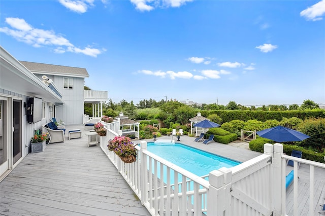pool featuring a patio area and a deck
