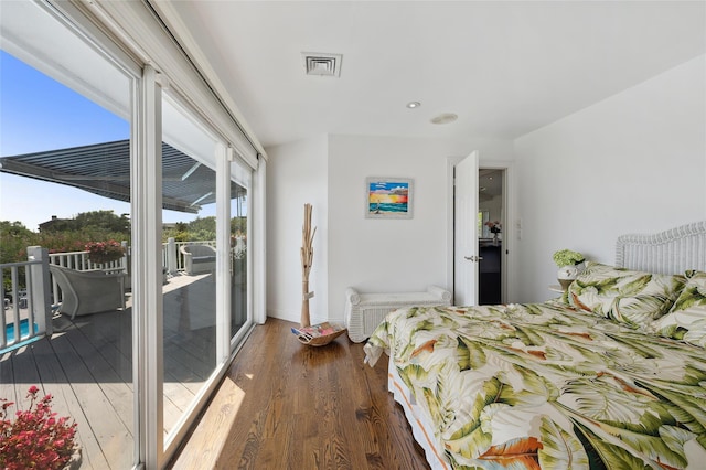 bedroom featuring visible vents, wood finished floors, baseboards, recessed lighting, and access to outside