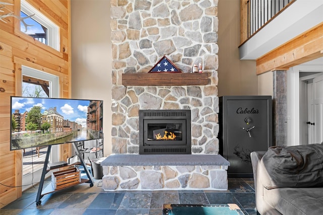 535 County Route 22, Middletown, NY 10940 - living room with a fireplace, stone tile floors, a towering ceiling, and healthy amount of natural light