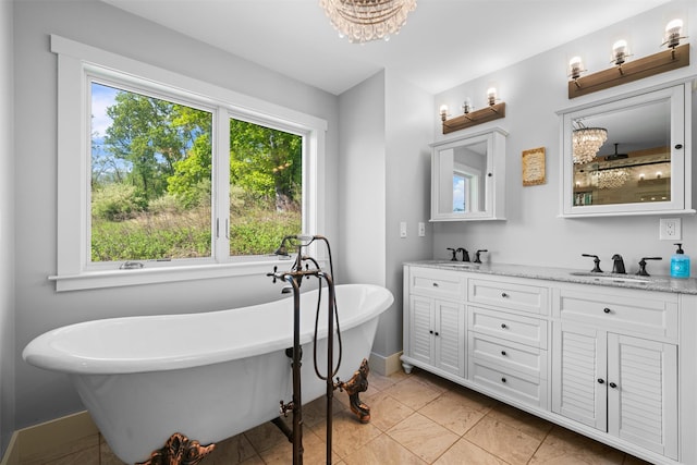 535 County Route 22, Middletown, NY 10940 - bathroom featuring double vanity, baseboards, a freestanding tub, tile patterned flooring, and a chandelier