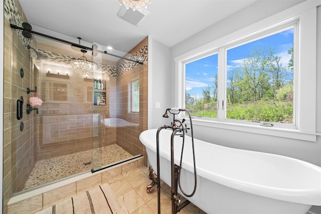 535 County Route 22, Middletown, NY 10940 - full bathroom featuring a shower stall, healthy amount of natural light, a soaking tub, and a chandelier