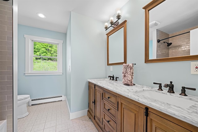 535 County Route 22, Middletown, NY 10940 - bathroom featuring a baseboard radiator, double vanity, toilet, a tile shower, and baseboards