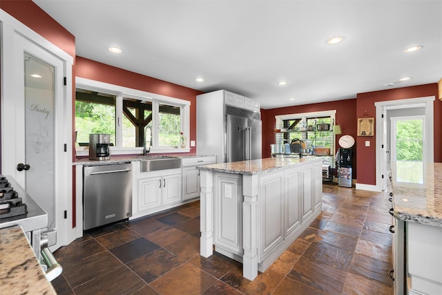 535 County Route 22, Middletown, NY 10940 - kitchen featuring stainless steel appliances, stone tile flooring, recessed lighting, white cabinetry, and light stone countertops