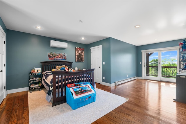 535 County Route 22, Middletown, NY 10940 - bedroom with a baseboard radiator, access to exterior, a wall mounted AC, wood finished floors, and recessed lighting