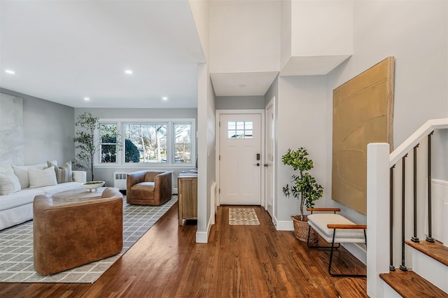 foyer entrance with recessed lighting, dark wood-style floors, stairway, and plenty of natural light
