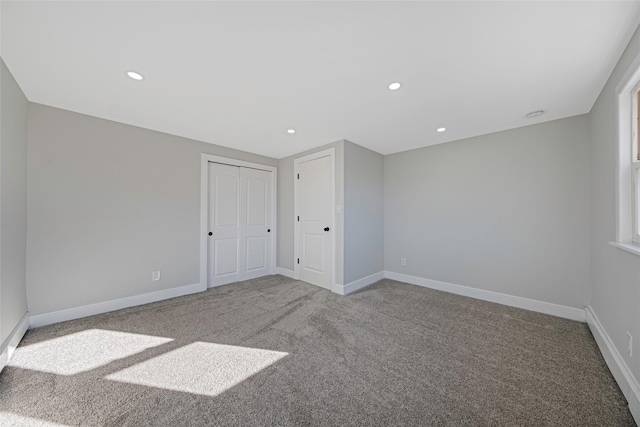 unfurnished bedroom with baseboards, carpet flooring, and recessed lighting