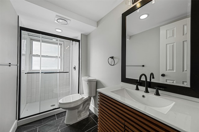 bathroom featuring a shower stall, vanity, baseboards, toilet, and marble finish floor