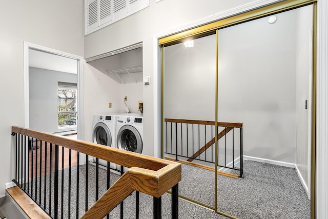 laundry room with laundry area, carpet, independent washer and dryer, and baseboards