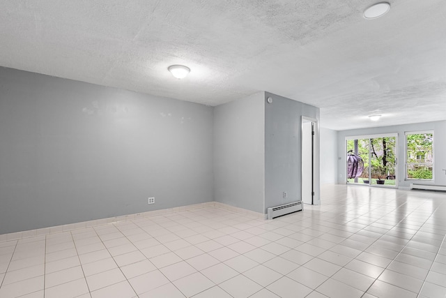 empty room featuring a baseboard radiator, a baseboard heating unit, and a textured ceiling
