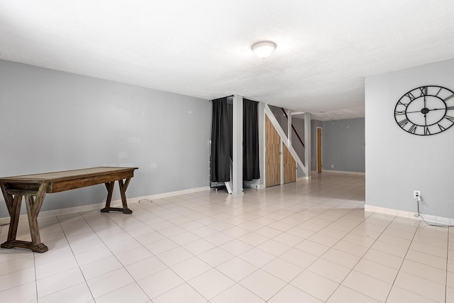interior space featuring baseboards and stairs