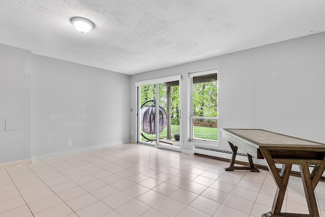 unfurnished room featuring a textured ceiling and baseboards