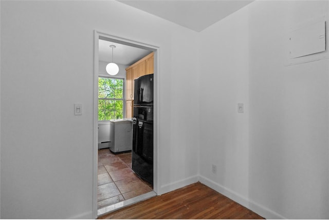 empty room with wood finished floors and baseboards