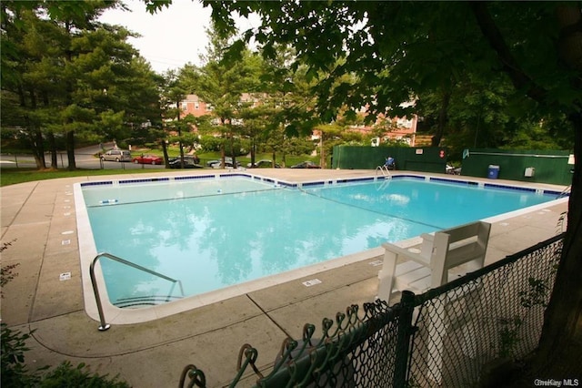 community pool with fence