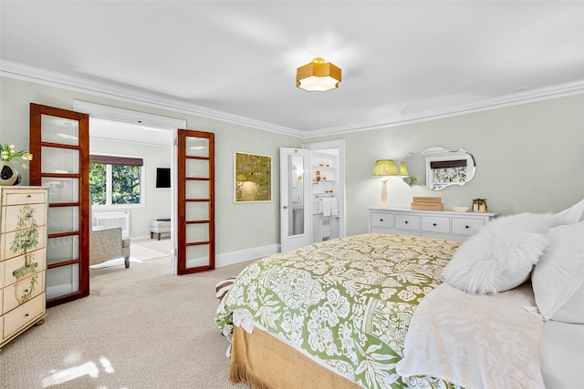 carpeted bedroom featuring crown molding, baseboards, and connected bathroom