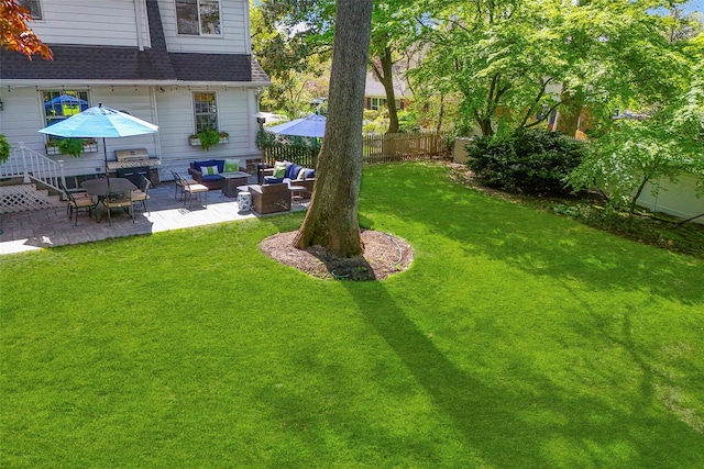 view of yard with an outdoor living space, a patio area, and fence