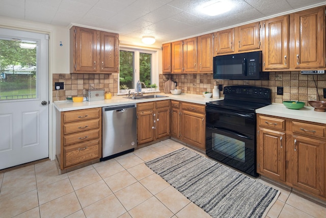 15 Riverview Farm Rd, Ossining, NY 10562 - kitchen featuring black appliances, a sink, brown cabinets, and tasteful backsplash