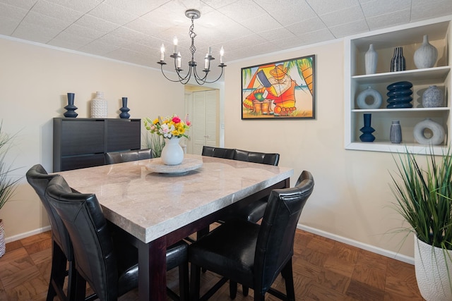 15 Riverview Farm Rd, Ossining, NY 10562 - dining room featuring baseboards, a chandelier, and built in shelves