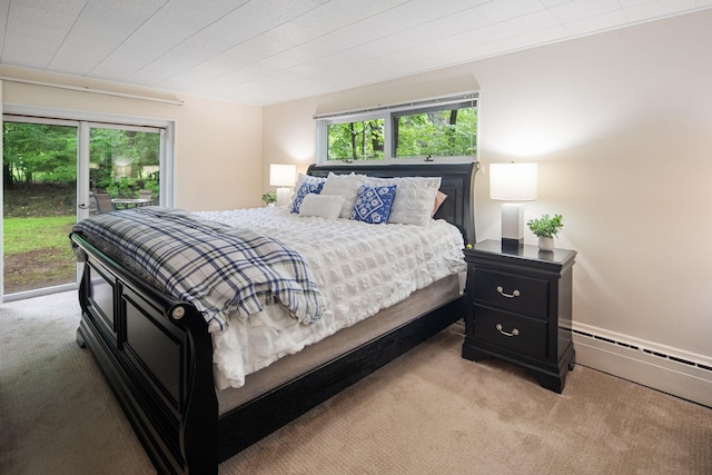15 Riverview Farm Rd, Ossining, NY 10562 - bedroom with light colored carpet, access to exterior, and a baseboard radiator