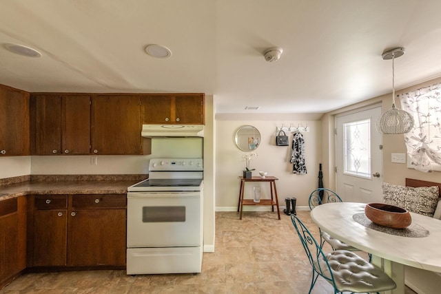 163 Smith Rd, Poughkeepsie, NY 12603 - kitchen featuring electric range, dark countertops, baseboards, under cabinet range hood, and pendant lighting