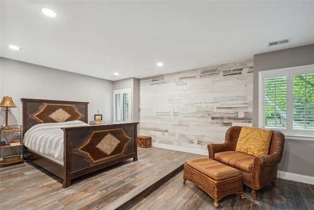 185 Old Pond Ct Unit 185, Jericho, NY 11753 - bedroom featuring baseboards, an accent wall, wood finished floors, and recessed lighting