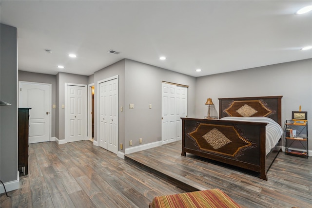 185 Old Pond Ct Unit 185, Jericho, NY 11753 - bedroom with baseboards, recessed lighting, wood finished floors, and multiple closets