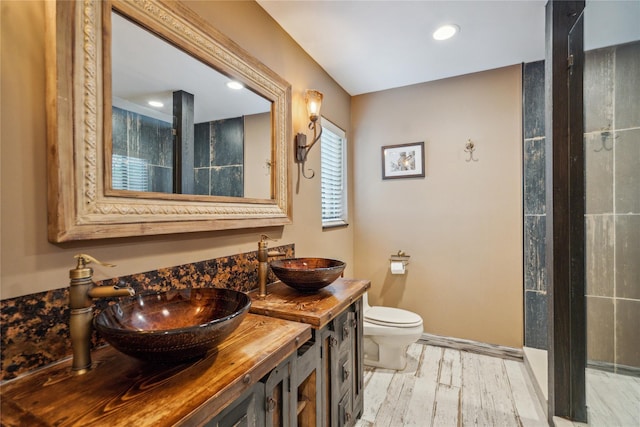 185 Old Pond Ct Unit 185, Jericho, NY 11753 - full bath with wood finished floors, toilet, double vanity, and recessed lighting
