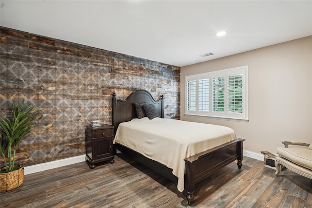 185 Old Pond Ct Unit 185, Jericho, NY 11753 - bedroom with an accent wall, baseboards, dark wood finished floors, and recessed lighting