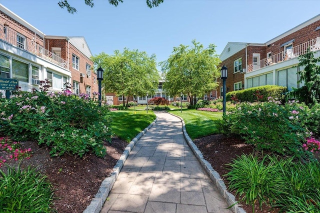 surrounding community featuring a lawn and a residential view