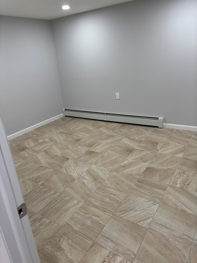 unfurnished room with recessed lighting, baseboards, and baseboard heating