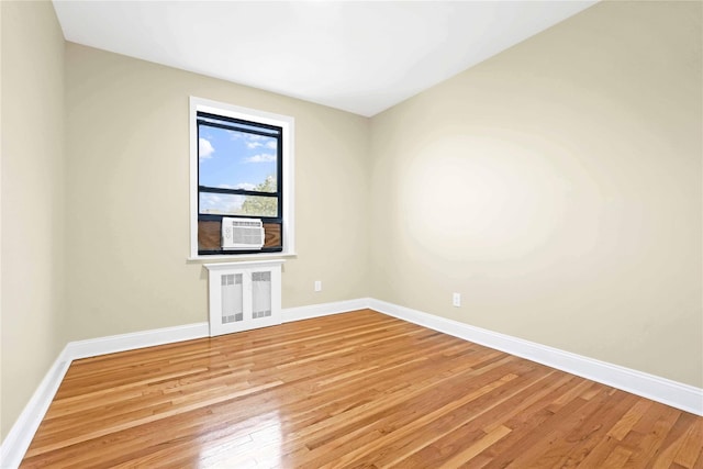 25-40 Union St Unit 6B, Flushing, NY 11354 - empty room featuring radiator, baseboards, and hardwood / wood-style floors