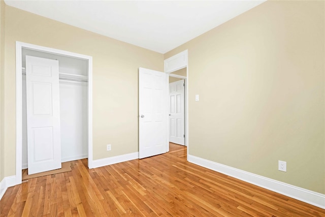 25-40 Union St Unit 6B, Flushing, NY 11354 - unfurnished bedroom with baseboards, a closet, and light wood-style flooring