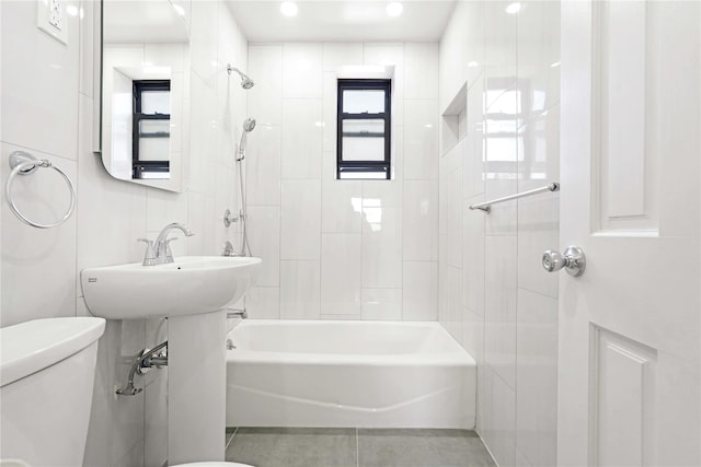 25-40 Union St Unit 6B, Flushing, NY 11354 - full bathroom with toilet, tile patterned floors, tile walls, and washtub / shower combination