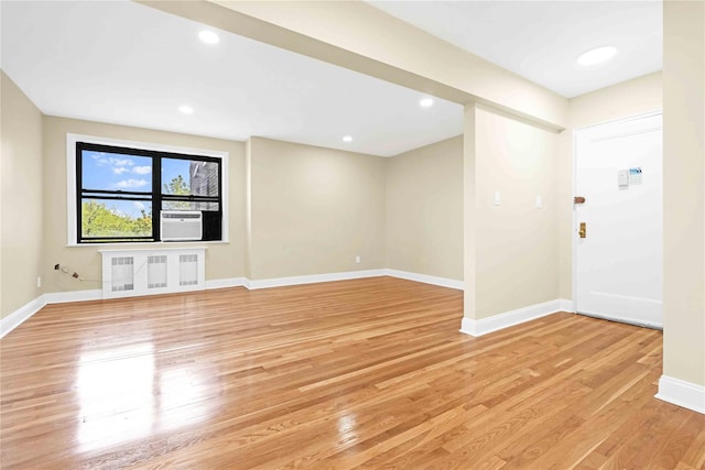 25-40 Union St Unit 6B, Flushing, NY 11354 - spare room with light wood-style floors, recessed lighting, baseboards, and radiator heating unit
