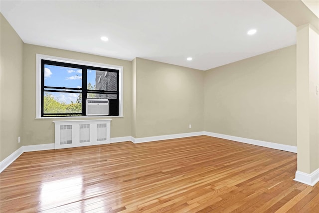 25-40 Union St Unit 6B, Flushing, NY 11354 - unfurnished room with baseboards, radiator, light wood finished floors, and cooling unit