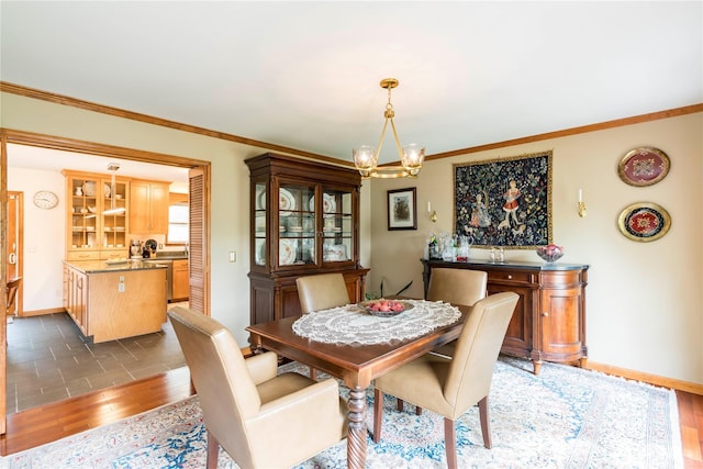 16 Charlotte Dr, Lagrangeville, NY 12540 - dining room with a chandelier, baseboards, ornamental molding, and wood finished floors