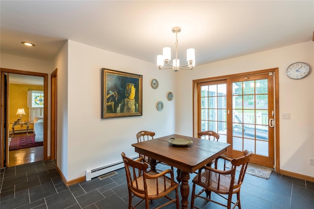 16 Charlotte Dr, Lagrangeville, NY 12540 - dining area featuring a chandelier, baseboards, and baseboard heating
