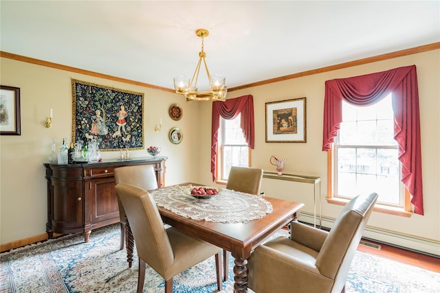 16 Charlotte Dr, Lagrangeville, NY 12540 - dining room with a chandelier, ornamental molding, wood finished floors, a baseboard heating unit, and baseboards