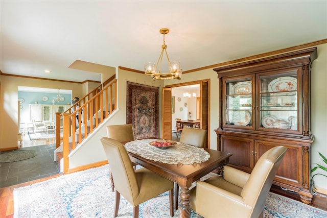 16 Charlotte Dr, Lagrangeville, NY 12540 - dining room with a chandelier, stairway, ornamental molding, baseboards, and wood finished floors