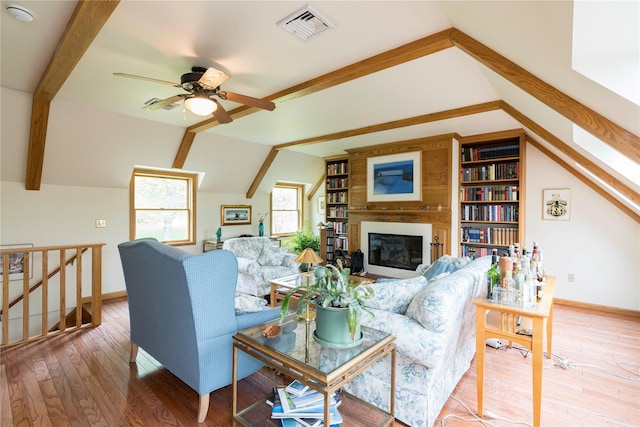 16 Charlotte Dr, Lagrangeville, NY 12540 - living room featuring ceiling fan, baseboards, wood-type flooring, and a glass covered fireplace