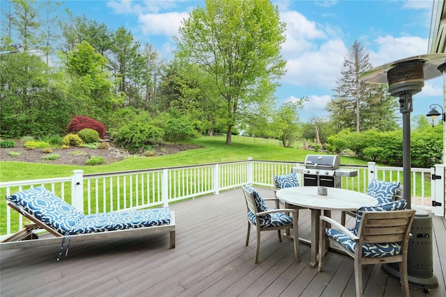 16 Charlotte Dr, Lagrangeville, NY 12540 - wooden terrace featuring a lawn, outdoor dining area, grilling area, and view of scattered trees
