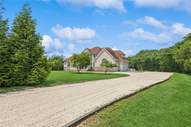 1465 Ackerly Pond Ln, Southold, NY 11971 - view of front of property with driveway, a front yard, and an attached garage