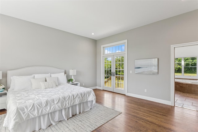 1465 Ackerly Pond Ln, Southold, NY 11971 - bedroom featuring french doors, access to outside, wood finished floors, ensuite bathroom, and recessed lighting